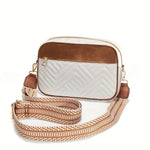 White crossbody bag with brown accents and a patterned strap on a white background